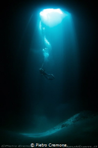 Cave and diver by Pietro Cremone 